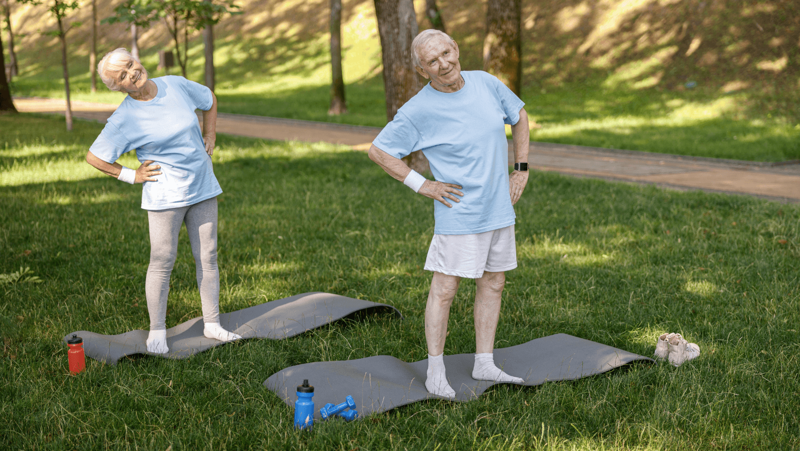 A group of seniors working out outside, doing dumbbell side bends