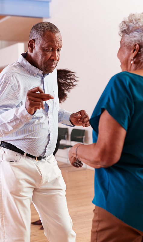 People Attending Dance Class In Community Center